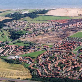 Looking east across Westlea in right foreground, Eastlea above, Milldale/Melrose left of centre.Scar left by Seaham colliery at centre, Seaham colliery housing above. Site of Vane Tempest Colliery at top right ready to start building the new East Shore Village estate in 2002.Copyright FlyingFotos  www.seahamfromtheair.co.uk