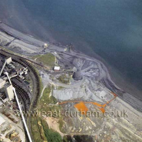 Dawdon Colliery shortly before the towers were demolished in 1992 showing polluted sea and beaches.