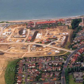 Building just beginning on the new East Shore Village Estate in June 2003.  Dene House Road (Lover's Lane) at right. Aged Miners Homes top centre.      Copyright FlyingFotos  www.seahamfromtheair.co.uk