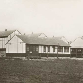 Seaham Hall School Holiday Camp built on the site of what is now Seaham Hall car park and recreation field, opened 1935, used by the military (American?) during WW2 then squatters moved in, living in squalour until the UDC provided heat and light and charged 5 shilling a week rent , known then as the Squatters Camp. Demolished c 1955