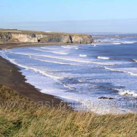 Looking north along the Blast Beach in 2007. The water treatment plant just visible on the clifftop, the site of the former Dawdon Colliery.