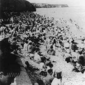 Looking north along the beach at Seaham Hall on a bank holiday weekend in 1961. Getting crowded as the tide comes in.