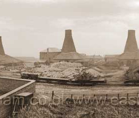 John Candlish opened his bottleworks in 1853 and absorbed the nearby Fenwick's Bottleworks in 1856. When he died in 1874 his factory consisted of seven bottlehouses. In this photograph the seventh ( close to Gallery Row at right ) has not yet been built
Photograph 1870.
Prior to these bottleworks there was a small glassworks in the yard of The Canterbury in North Railway St