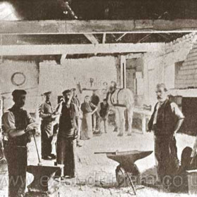 Candlish bottleworks, blacksmith's shop 1890. Centre foreground Mr Mayhew (foreman), right foreground Mr Mackey