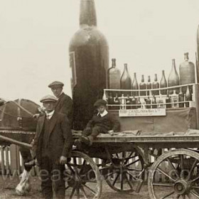 Candlish Bottleworks display wagon. Head horsekeeper Andy Swan standing. Photograph before 1920, possibly at Seaham Flower Show or Coronation celebrations in 1911.