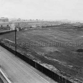 This reclaimed land pictured in 1950 was the site of the former Bottleworks, it was also the site of Seaham's only racecourse from the 1830s until 1852. Horseracing was a regular feature here with races such as the Town Stakes, Pilot Stakes and hurdle races among the events. Roberts Sq centre top, coal drops on the dock staithes top right. Stewart St  Primitive Methodist Chapel at first bend in road. Entrance to gasworks, left foreground.