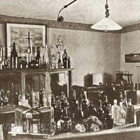 Candlish Bottleworks, sample room in 1890, note the electric light.