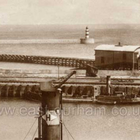 The new lifeboat house shown here, for a short time No 2 Station, it was completed in 1909, the old slipway used by the Skynner was practically dry at low water but here it was possible to launch at any state of the tide  down a 150 ft slipway.
The short wave screen was purposely built to protect the lifeboat during launch.
From 1909 to 1911 Seaham had two lifeboats, the old "Skynner" and the "experimental" motorised "Bradford", it was the Bradford which was housed here.