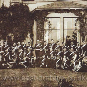 Volunteer (Territorial) Band in (Seaham?)  John Lewis with cornet sitting to right of conductor.