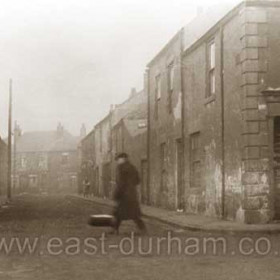 Looking up Little John Street from th junction with Back North Terrace, the houses visible at the top of the street are North John St (John St).Photograph c1934