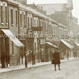 Church St probably around 1905 (not earlier) with sailor in centre of road wearing frock coat, tight stockings or leggings. and shoulder length hair.