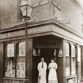 Danish Dairy Co. at the junction of Church St and South Cres. Mr and Mrs Richardson (they also at some stage, probablyafter this photo was taken traded under their own name in the same premises before 1910.D D Co was trading here with W Allen as manager in 1893