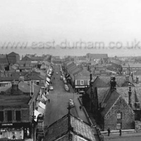 Ruben's Arcade opened 1928,(left foreground), previously dwelling houses.National  School  built in 1848, disused after 1973 and demolished in 1980.  Photograph from St John's church in the early 1960s.