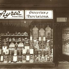 Ayres Grocery shop in the New Arcade at the junction of Church St and Blandford Place  in 1934.The Ayres family also traded as grocers at 34 Frances St since around the end of WW1.By 1939 it would appear that the New Arcade shop had re-located to 39 Church St.