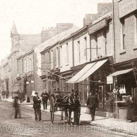 Church St looking west. original United Methodist Free Church before it was destroyed by fire in 1904. Built in 1866, rebuilt in 1877. Originally the upstairs of 2 houses were converted into a church known as the Tabernacle, these houses were demolished in 1866. Wright the butcher opened this shop at 73 Church St before 1890
Photograph 1899