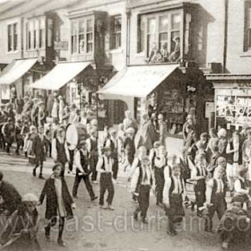 Youth band marching down Station Road, occasion and date not known but around 1930.