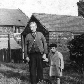 Thomas Haswell snr and his grandson Thomas Ernest Haswell in the garden of 22 Cook St, Seaham Colliery. Photograph from Anthony Haswell