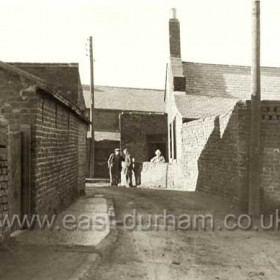 Northern gable end of California St at left, gable end of Infant St at right, (the front and gable of this house can be seen in A 14. Doctor St visible behind.