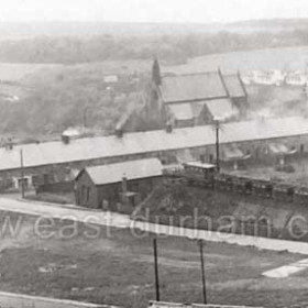 Church Street at centre then Coronation Buildings and Conservative Club just visible at extreme right. Christ Church behind and prefabs at top right. Photograph 1950s.