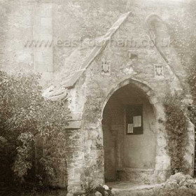 Entrance to  the 12th century St Andrew's church, Dalton le Dale in the late 1800's  Coats of Arms of the Bowes family above the doorway.