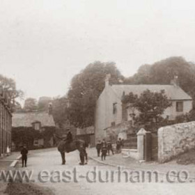 Looking east through Dalton le Dale around 1900-1910. East and Hornsby's Farms, the sexton's cottage, Rose Cottage and the old vicarage to the right (demolished mid 1960s)