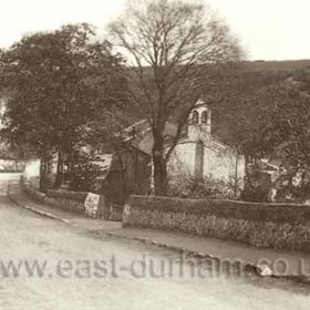 Looking east from near the Times Inn junction down to church and village around 1900.