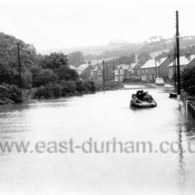 Sea Scouts in two dinghies rescue folk from their flooded homes, August 1971