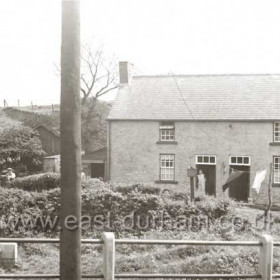 Burnside Cottages  -  Mrs Pinkney standing in doorway in the 1950s.When Dalton Bridge was built in 1789 Widow Thompson's pub (now Burnside Cottages) was by-passed. See next photograph