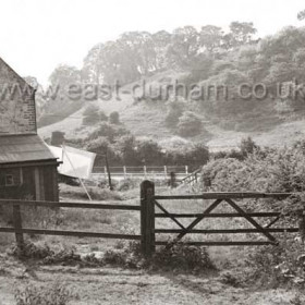 Building shown is known as Burnside Cottages, prior to 1789 this was Widow Thompson's pub.  Gate in foreground is on the line of the Old Coach Road... This road ceased to be used when Dalton Bridge was built in 1789.See next photograph.