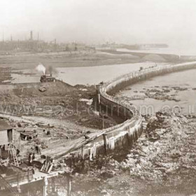 South pier sea wall and harbour wall forming boundaries of reclaimed beach.October 1900.