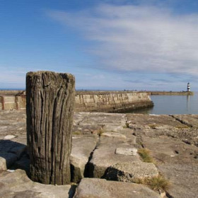 View across the dock to the lighthouse in 2007.Photograph by Brian Slee.