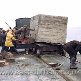 Pushing huge concrete block off pier, reason and date not known.