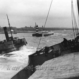 Tug "Seaham" towing a ship into dock c1950