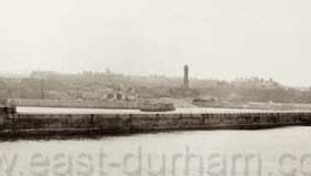 View from the sea, new lighthouse (1905), old lighthouse at centre (1836), Vane Tempest Colliery (1926-1993)Photograph probably 1934