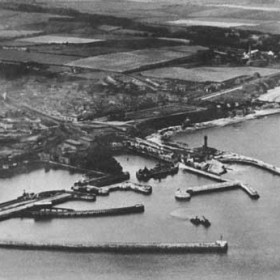 General view of dock c1930, old lighthouse with "Slope" below just right of centre.Only a very few houses at the eastern end of Dene House Road (Lover's Lane)