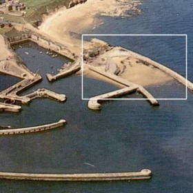 View of dock in the 1980s with the "Slope" sheltering between the inner and outer North Piers.The swimming club used to swim off the inner pier in this relatively safe water.