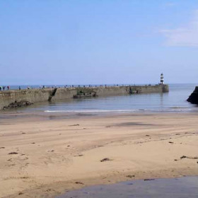 Looking from the Slope past anglers on the North Pier to lighthouse 17/6/2007Photograph by Brian Angus.