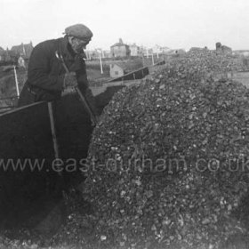 Mr Watson, a trimmer working on the staithes c1960