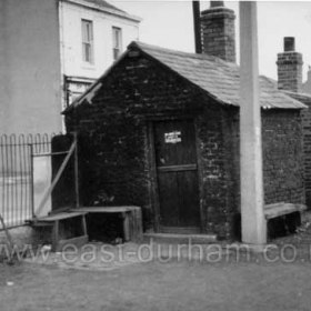 Sheds just north of South Terrace/Foundry Rd rail crossing, Edinburgh Castle in background. The nearest shed was used by the men who controlled the traffic when wagons were crossing the road. The sign on the door reads "No Admittance Except on Business"
Photograph 1960s