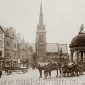 Market Place, Durham City, the Church of St Nicholas in the background. The pant in the right foreground was demolished in 1923.