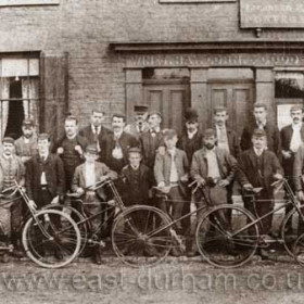 Easington Cycle Club? Signs above the shop advertise Porter, Spirits, Wines, Hay, Corn and Good Stabling.