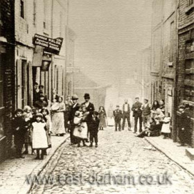 Spring Garden Lane, sign at left reads Hannah Welsh Registered Common Lodging House.