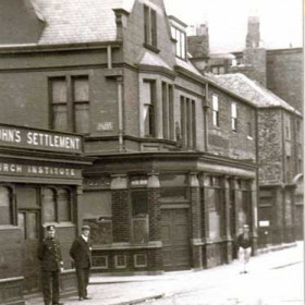 Prospect Row/Silver St.
In the 1800s every midsummer night was the excuse for a  strange annual  Druidic ceremony in Silver St with food and drink laid out round bonfires through which residents sang and danced to cleanse themselves of evil . For many years this was a very wild  East-End occasion  These buildings are clearly of much later period but still include the usual charitable institute as well as the inevitable pub.
Photograph Norman Kirtlan, information from Len Charlton.