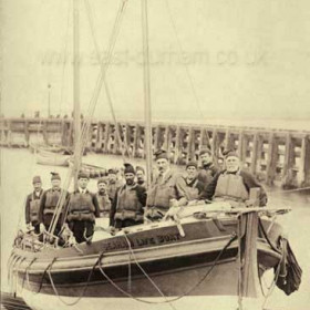 The Elliot Galer, a 38 ft x 10 ft non self-righter fitted with a single 34 hp petrol engine, capable of 7 knots.
Her coxwain, William Miller (front left with hand on tiller in this photograph) served on the Sisters Carter of Harrogate, the Skynner, the Bradford Reserve which was in Seaham only from 1908 to 1911 and the Elliot Galer. A lifeboatman from 1885 to 1919.