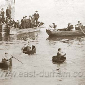 Regatta day in the dock. An annual event during the !880's and 90's it featured cobble, canoe and the trimmers shovel race shown here among the events.Photograph Aug 13 1896.