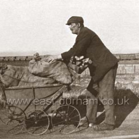 Taking sea coal from the Blast Beach at Dawdon. Many of these men (Blasties) travelled from Sunderland, 5 miles of hard work, mostly they used  bikes, not prams as in this photograph taken in the 1920s.