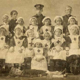 1917, Salvation Army children dressed as military nurses, soldiers and a casualty. Occasion meybe a parade or fundraising event. Mrs William Miller back right.
Photograph from Gordon Quinn