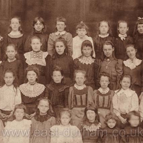 A group of Seaham schoolgirls, various ages and all very well dressed including their teacher. Probably a private school, there were several in town.