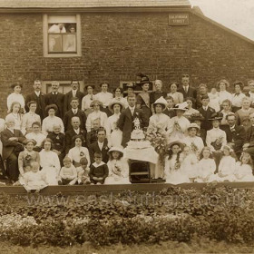 Rowell - Teasdale wedding group outside 1 California Street in 1906