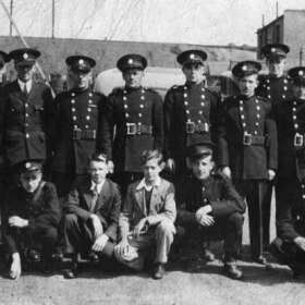 South Hetton contingent of the National Fire Service in 1942, behind the garage on Front Street where their appliance was kept.  My father, John Sheldon Wesley Clark, is crouching at the right end of the front row; I suspect that the left hand one of the two in 'civvies' is George Stewart, who was a bricklayer down the pit.  Like my father, George became a Church Warden and then Church Warden Emeritus at South Hetton Holy Trinity Church.                         .Photograph and caption from Sheldon Clark.